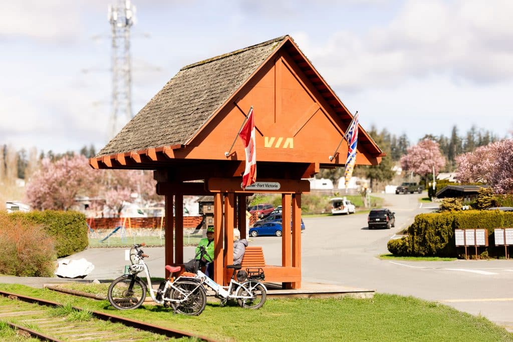 Fort Victoria RV Park main entrance with flags and wooden pavilion