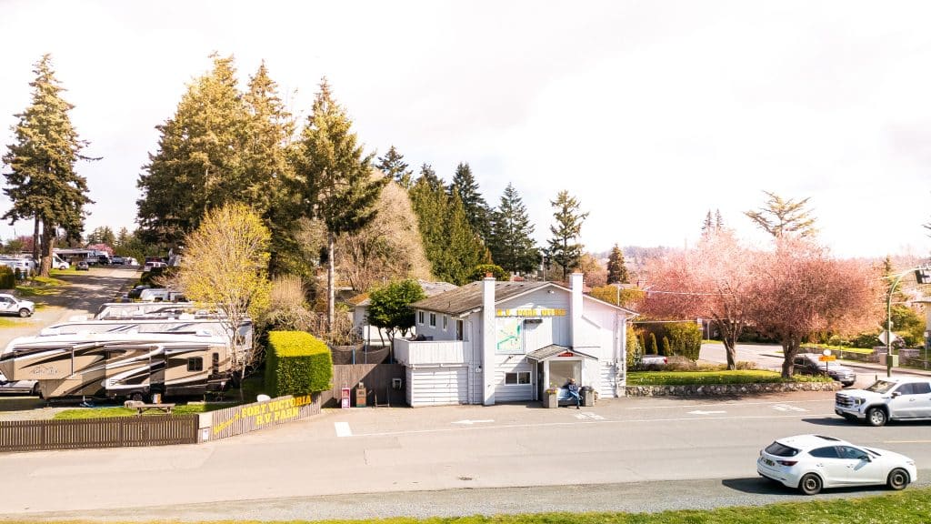 Gated entrance surrounded by trees at Fort Victoria RV Park