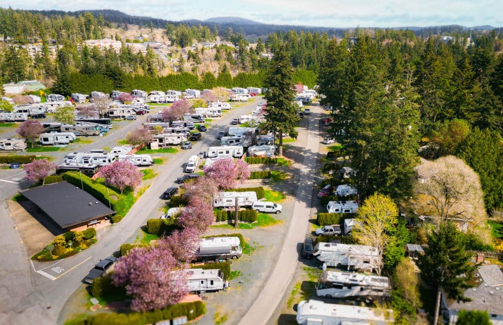 Wide view of Fort Victoria RV Park showing multiple RV rows and greenery.