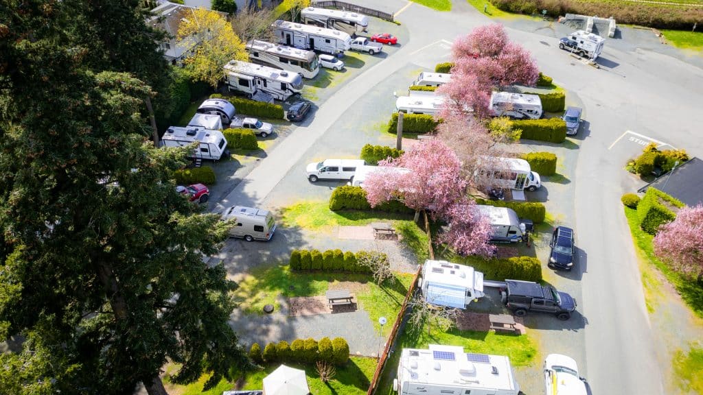 Drone view of the Fort Victoria RV Park office surrounded by RV sites and trees.