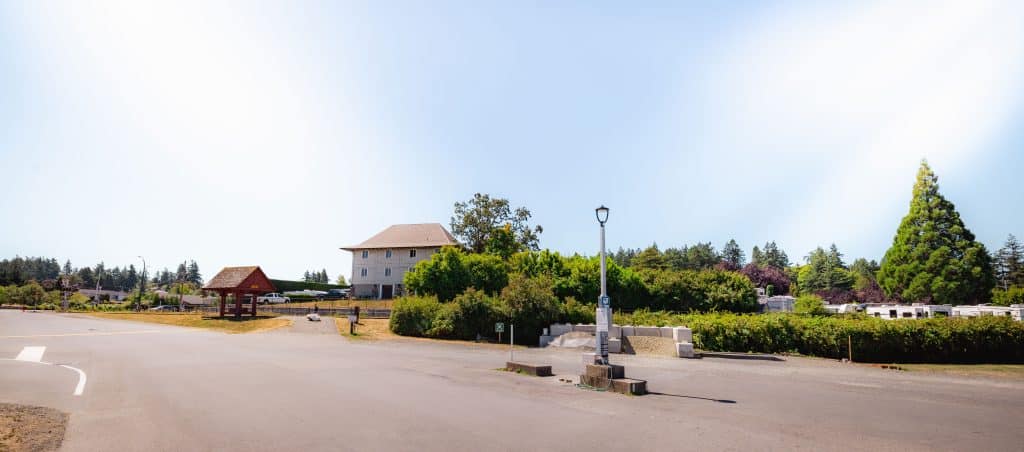 Open courtyard area with lamp post and building in the background at Fort Victoria RV Campground