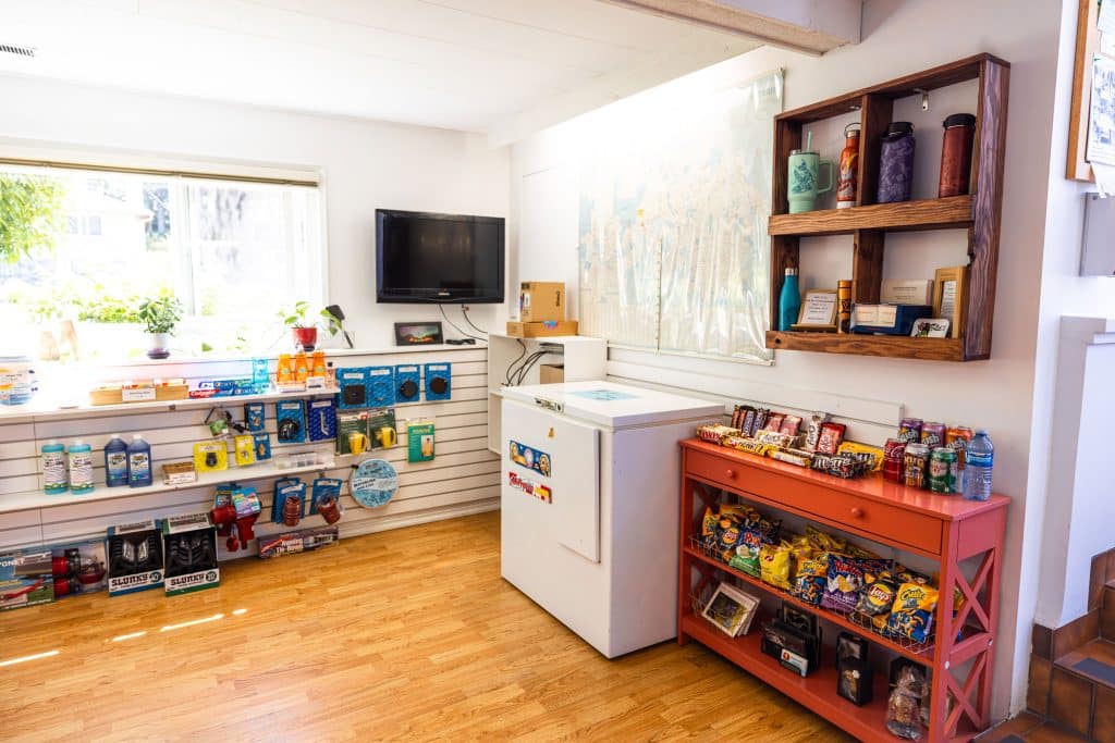 Shelves stocked with snacks and drinks inside Fort Victoria RV Campground store
