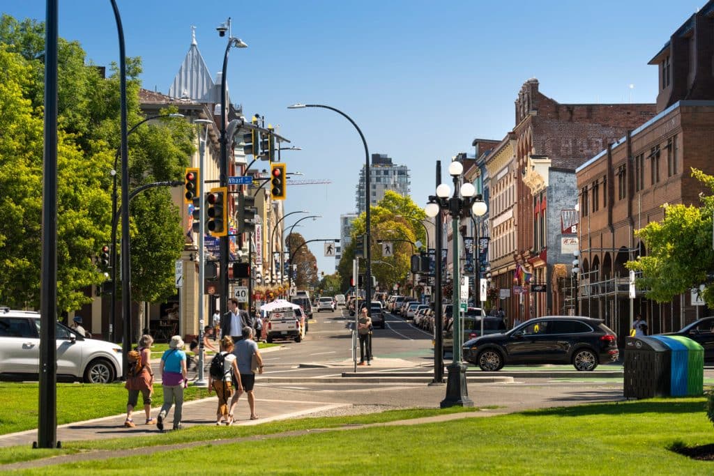 Pedestrian-friendly downtown Victoria street with shops.